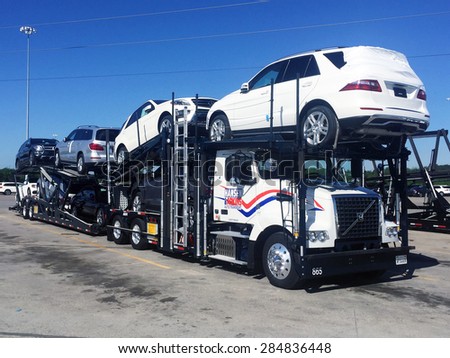 VANCE, AL-MAY, 2015:  Mercedes Benz vehicles being loaded on a transport truck (automotive car carrier) at the factory for delivery to a dealership.