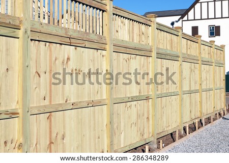 Wood fence in a housing subdivision.