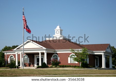 Small office or medical building with an American flag.