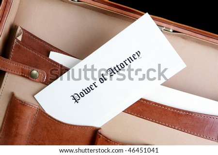 Power of Attorney document in a leather briefcase