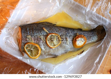 Rainbow trout baked with garlic and lemon in foil. Healthy food