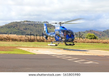 KAUAI, HAWAII - SEPTEMBER 20 : Blue Hawaiian helicopter on September 20, 2012 in Kauai, Hawaii, USA. Blue Hawaiian is the only helicopter tour company serving all four major Hawaiian Islands