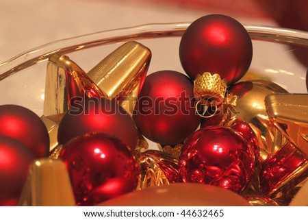 Christmas decoration - red and golden glass balls in glass dish