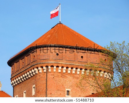 Wawel Royal Castle tower with Polish flag with black mourning band after death of the president