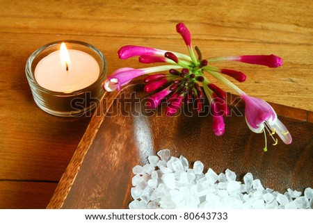 Spa still life. Honeysuckle flower, candle and sea salt
