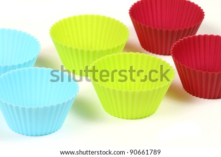Cupcake silicon baking cups over white background