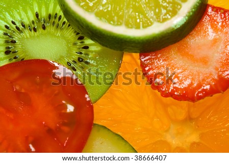 Fruits and vegetables back-lighted ( tomato, strawberry, kiwi, orange, lime, cucumber )
