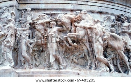 Relief marble sculpture scene of roman battle expedition. Image taken at Vittoriano monument, Rome, Italy