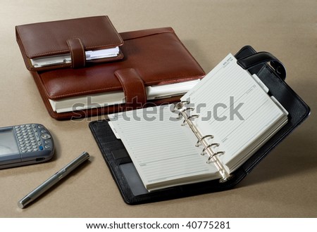 Set of 2010 agenda, phone book, pen and digital diary
