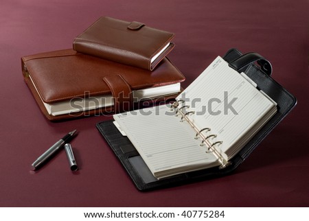 Set of agenda 2010, phone book and pen