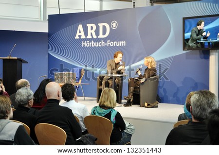 LEIPZIG, GERMANY - MARCH 15: Unidentified authors attend a book presentation at Leipzig Book fair on March 15, 2013 in Leipzig, Germany. Leipzig Book Fair is the most important spring event for the publishing.