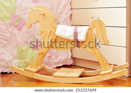 A beautiful handmade wooden horse in a kids' bedroom