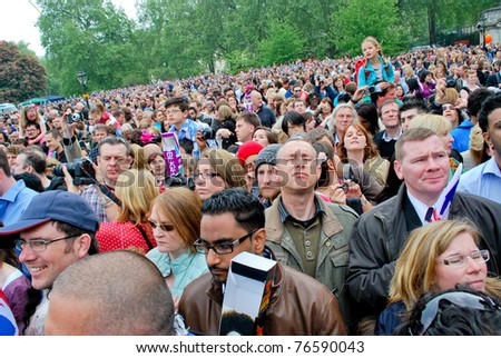 LONDON, UK - APRIL 29: The crowd waiting for the first kiss of the royal couple on the Mall near the Buckingham Palace, April 29, 2011 in London, United Kingdom