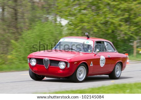MUTSCHELLEN, SWITZERLAND-APRIL 29: Vintage race touring car Alfa Romeo Giulia Sprint GT Veloce from  1966 at Grand Prix in Mutschellen, SUI on April 29, 2012.