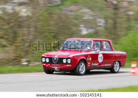 MUTSCHELLEN, SWITZERLAND-APRIL 29: Vintage race touring car Alfa Romeo Giulia from  1976 at Grand Prix in Mutschellen, SUI on April 29, 2012.  Invited were vintage sports cars and motorbikes.