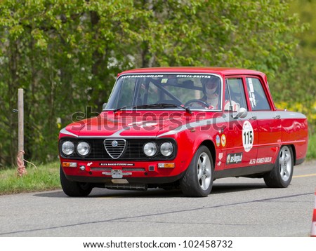 MUTSCHELLEN, SWITZERLAND-APRIL 29: Vintage race touring car Alfa Romeo Giulia from 1976 at Grand Prix in Mutschellen, SUI on April 29, 2012.  Invited were vintage sports cars and motorbikes.