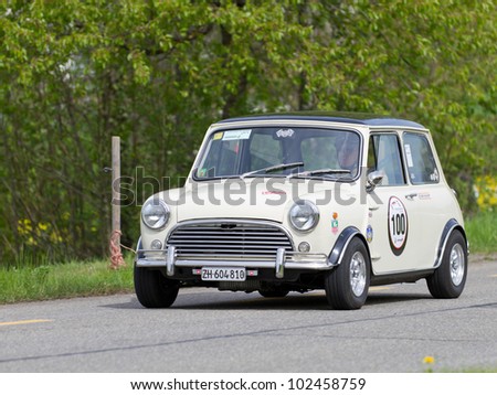 MUTSCHELLEN, SWITZERLAND-APRIL 29: Vintage race touring car Morris Mini Cooper S from 1969 at Grand Prix in Mutschellen, SUI on April 29, 2012.  Invited were vintage sports cars and motorbikes.