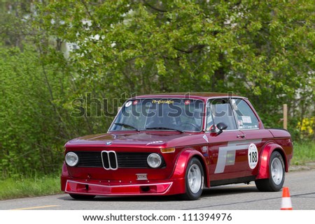 MUTSCHELLEN, SWITZERLAND-APRIL 29: Vintage race touring car BMW 2002 Tii Gruppe 2 from 1968 at Grand Prix in Mutschellen, SUI on April 29, 2012.  Invited were vintage sports cars and motorbikes.