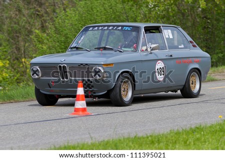 MUTSCHELLEN, SWITZERLAND-APRIL 29: Vintage race touring car BMW 2002 touring from 1972 at Grand Prix in Mutschellen, SUI on April 29, 2012.  Invited were vintage sports cars and motorbikes.