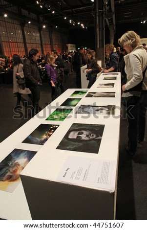 ZURICH - JANUARY 18: Visitors crowd in the exhibition hall of photo 09 the most important Swiss show of photographic work held for the 5th time January 18, 2010 in Zurich, SUI.