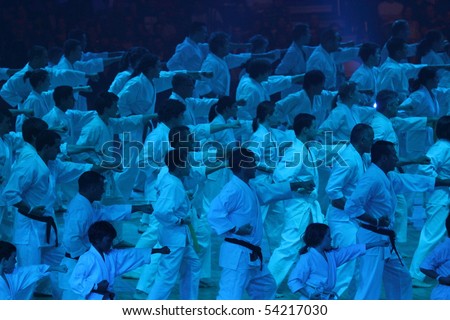 BASEL - MAY 29: Large groups perform synchronously at the Budo Gala festival May 29, 2010 in Basel, Switzerland. Main attraction was Jean Claude van Damme.