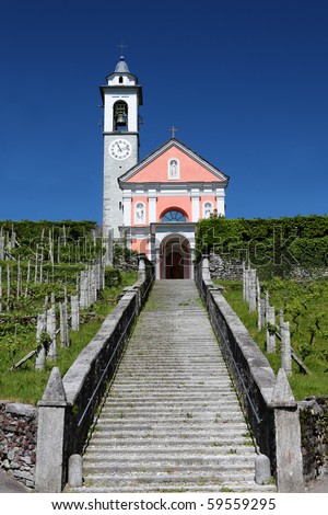 long flight of stairs leading up to a charming bright church on a hill, concept for path to religion, belief, Jesus,