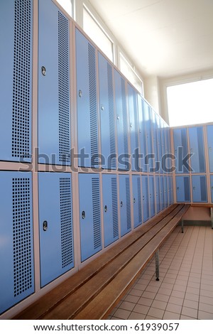 classic locker room with light blue rows of lockers
