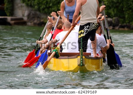 MEILEN - JUNE 12: Athletes fight hard for victory and had fun at the dragon boat racing festival June 12, 2010 in Meilen, Switzerland. Participants were also staff from institutes of EMPA and ETH