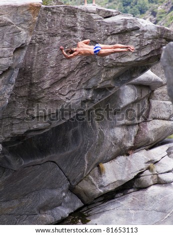 LOCARNO - JULY 23: Cliff diving athlete  Oleg Vyhsyvanov compete in the WHDF European Championship 2011 with dives from up to 20m high at Ponte Brolla, .July 23, 2011 in Locarno, Switzerland.