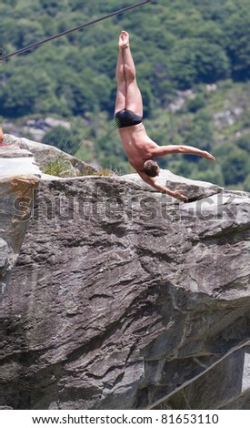 LOCARNO - JULY 23: Cliff diving athlete Andreas Marchetti competes in the WHDF European Championship 2011 with dives from up to 20m high at Ponte Brolla July 23, 2011 in Locarno, Switzerland.