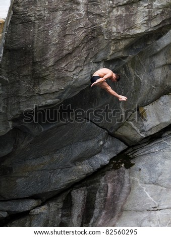 LOCARNO - JULY 23: Cliff diving athlete Blake Aldridge competes in the WHDF European Championship 2011 with dives from up to 20m high at Ponte Brolla July 23, 2011 in Locarno, Switzerland.