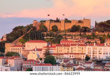 historic mediterranean architecture with with castle  Sao Jorge at sunset in Lisboa, Portugal