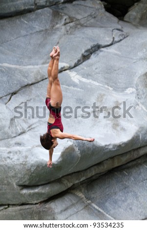 LOCARNO - JULY 23: Cliff diving athlete Anna Bader competes in the WHDF European Championship 2011 with dives from up to 20m high at Ponte Brolla July 23, 2011 in Locarno, Switzerland.