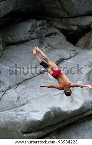 LOCARNO - JULY 23: Cliff diving athlete Anatolii Shabotencko competes in the WHDF European Championship 2011 with dives from up to 20m high at Ponte Brolla July 23, 2011 in Locarno, Switzerland.