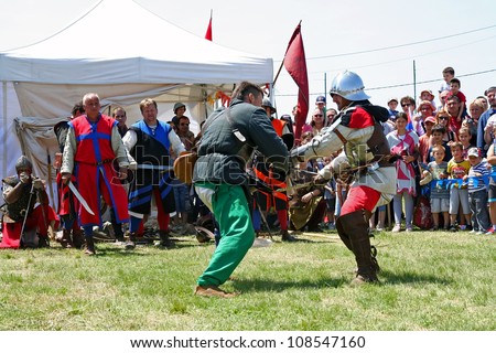 BELGRADE - JUNE 3: A Knight fight with knives on annual Knight tournament June 3, 2012 in Belgrade, Serbia.