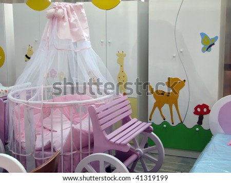 kids room with baby bed. pink baby bed.