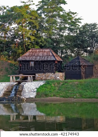 old country water mill. wooden water mill.