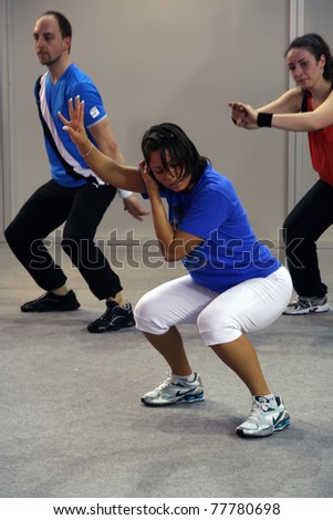 BELGRADE - MAY 21: A fitness exercise session on 1st International Lady Fair May 21, 2011 in Belgrade, Serbia.