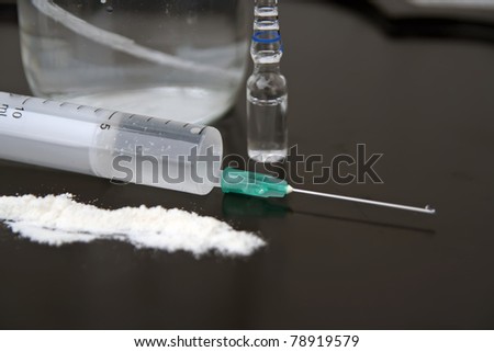 Narcotic use. Narcotic spoon and disposable syringe.