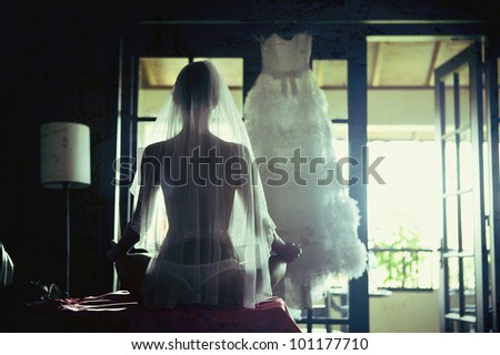 young woman sitting in a veil from the back of the form