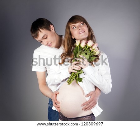 Portrait of a pregnant wife and future father