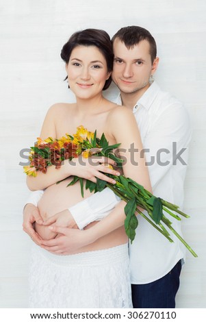 Portrait of husband and pregnant wife