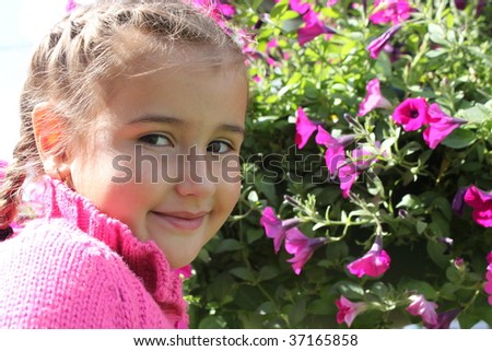 Girl in a pink sweater and a pink flowered