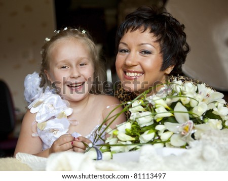 a pretty bridesmaid and cute flower girl