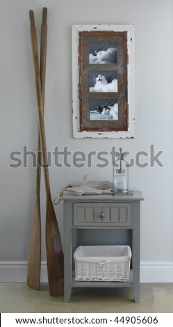 Bedside table with oars and photo of cat