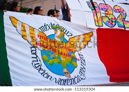 BARCELONA, SPAIN. SEPTEMBER 15TH: Unidentified Mexicans from #YoSoy132  protest against the electoral fraud in Mexico, on 15/Sept/2012 in Barcelona during the ceremony of the mexican independence day.