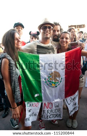 BARCELONA-JULY 6: Unidentified mexicans protest against the electoral fraud in Mexico during Julieta Venegas concert at the Cruilla Music Festival in Barcelona, on July 6, 2012.