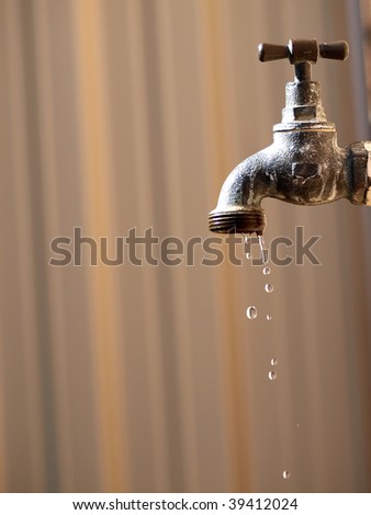 old rusty tap leaking water