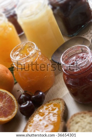 A still life of fruit jam on a table