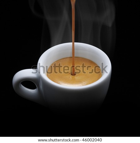cup of espresso while are filling in a coffee machine, on black background, splash, still life.